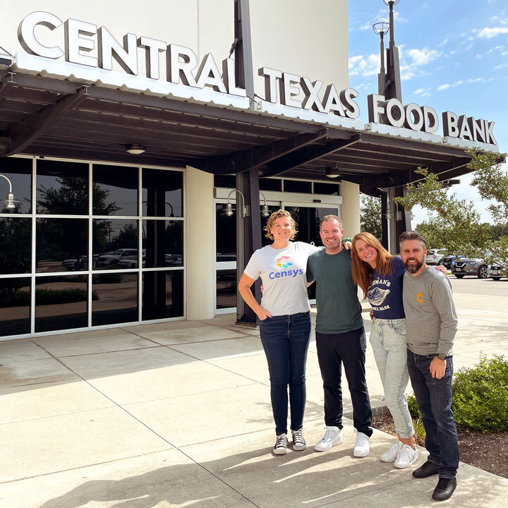 A group of four Censys employees in front of the Central Texas Food Bank